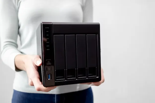 a person holding a black device