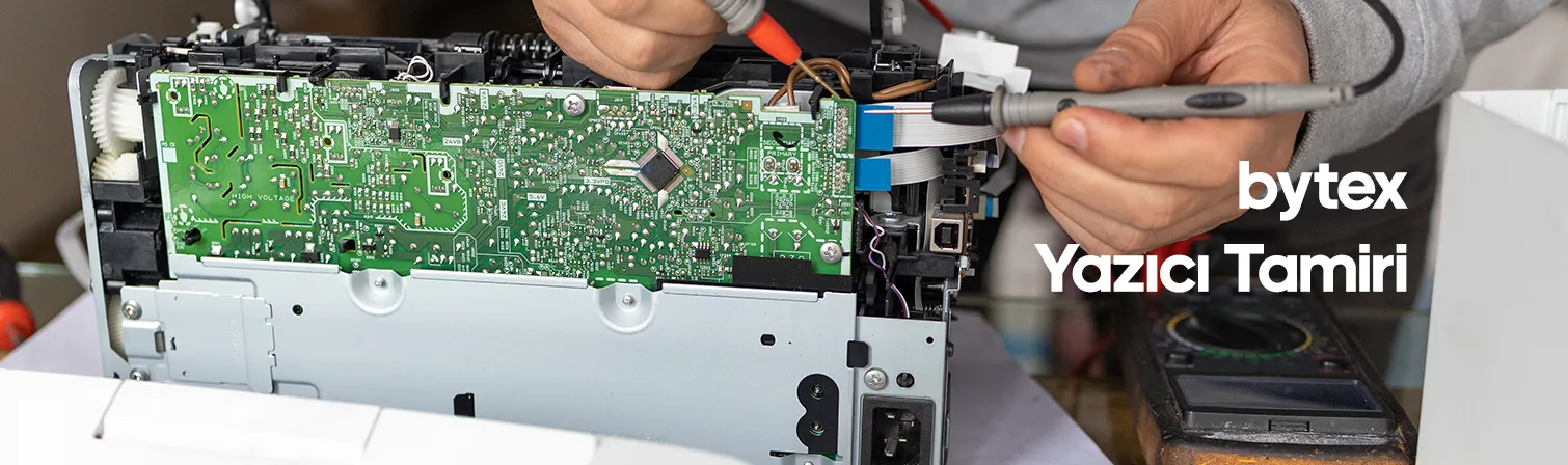 Yazıcı Tamiri Hızlı ve Güvenilir Çözümler a person fixing a circuit board